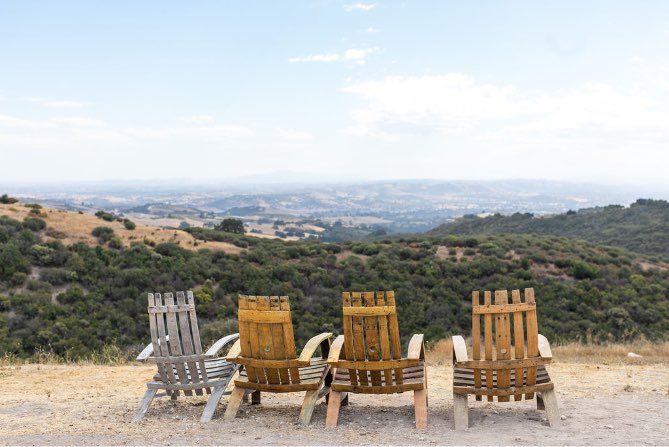 four relaxing chairs overlooking the Paso Robles vineyards at Calcareous Vineyard