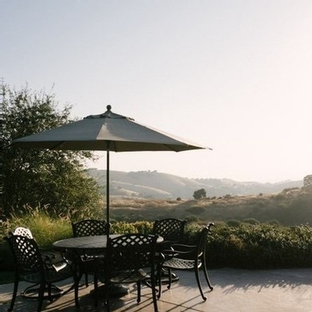 A shaded patio table at Calcareous Vineyard Winery in Paso Robles